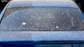 Rear view of a dirty car window covered with a layer of dry dust. Royalty Free Stock Photo