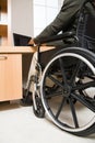 Rear view of a disabled man in a wheelchair