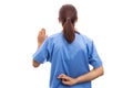 Rear view of dishonest woman nurse or doctor making swear gesture.