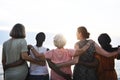 Rear view of diverse senior women standing together at the beach Royalty Free Stock Photo