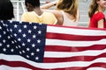 Rear view of diverse women group with American nation flag