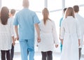 Rear view. doctors of the medical center walking in the corridor