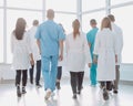 rear view. doctors of the medical center walking in the corridor