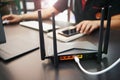 Rear view of Dual Band Router or Wireless AC router with business man using a computer in home office background . Computers and Royalty Free Stock Photo