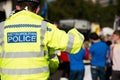 Metropolitan Police officer helping members of the public with their enquiries.