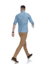 Rear view of eager casual man walking Royalty Free Stock Photo