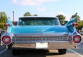 Rear view of emerald blue Cadillac sedan