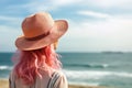 Rear view of enjoying woman by sea shore. Unrecognizable pink haired lady in straw hat portrait. Ai generative