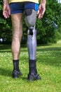 Rear view on false leg of man standing on grass Royalty Free Stock Photo