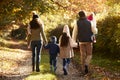 Rear View Of Family Enjoying Autumn Walk In Countryside Royalty Free Stock Photo