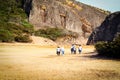 Rear view of a family and friends hiking in the wild forest