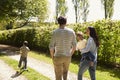 Rear View Of Family Going For Walk In Summer Countryside Royalty Free Stock Photo