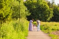 Rear View Of Family Going For Walk In Summer Countryside. Royalty Free Stock Photo