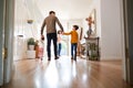 Rear View Of Family Leaving Home On Trip Out With Excited Children Royalty Free Stock Photo