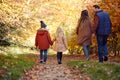 Rear View Of Family With Parents And Children Holding Hands Walking On Path In Autumn Countryside Royalty Free Stock Photo