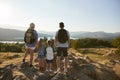 Rear View Of Family Standing At Top Of Hill On Hike Through Countryside In Lake District UK Royalty Free Stock Photo