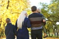 A rear view of family with two small children on a walk in autumn nature. Royalty Free Stock Photo