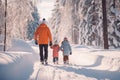 Rear view of a man and his two children in winter nature in the forest walking in the snow Royalty Free Stock Photo