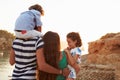 Rear View Of Family Watching Sunset Over Harbour Royalty Free Stock Photo