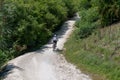 Rear view fast mountain rider biker from behind in nature Royalty Free Stock Photo