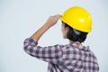 Female architect wearing hard hat against white background Royalty Free Stock Photo