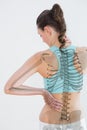 Rear view of female suffering from muscle pain Royalty Free Stock Photo