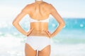 Rear view of fit woman in bikini on beach Royalty Free Stock Photo