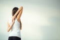 Rear view of fit woman doing gomukhasana in yoga class Royalty Free Stock Photo