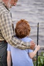 Rear View On Friendly Awesome Caucasian Child Boy Came To Fish With Grandfather Royalty Free Stock Photo