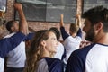 Rear View Of Friends Watching Game In Sports Bar On Screens Royalty Free Stock Photo