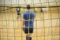 Rear view of futsal goalkeeper with net of gates Royalty Free Stock Photo