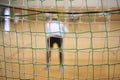 Rear view of futsal goalkeeper with net of gates Royalty Free Stock Photo