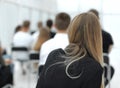 Rear view. a group of diverse young people sitting in a conference room. Royalty Free Stock Photo