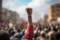 Rear view of a group of people raising their hands in protest, A raised fist of a protestor at a political demonstration, AI