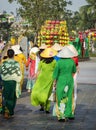 Rear view of a group of women wearing Vietnamese traditional dresses at Hoi An old town