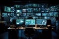 Rear view of a hacker in a dark room with computers and monitors, Computer monitors in a room with many screens and monitors on