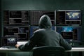 Hacker Using Multiple Computers For Stealing Data Royalty Free Stock Photo