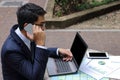 Rear view of handsome young businessman is talking on the phone for his work. Royalty Free Stock Photo