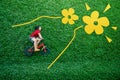 Rear View of a Happy Asian Kids. Girl on Bicycle Lay Down at Green lawn in Spring or Summer Day Royalty Free Stock Photo