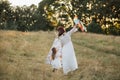 Happy family mother and daughter, having fun together on the wild field, running with colorful kite Royalty Free Stock Photo