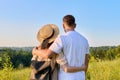 Rear view, happy middle aged couple looking at the horizon on summer nature Royalty Free Stock Photo