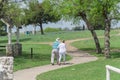 Rear view of happy senior couple walking in the Bluebonnet park