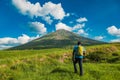 Rear view of a hiker against the background of Mount Ol Doinyo Lengai in Tanzania