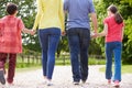 Rear View Of Hispanic Family Walking
