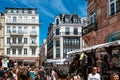 Rear view of Hundreds of people walking on the street of Strasbourg during the