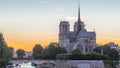 Rear view of Notre Dame De Paris cathedral day to night timelapse after sunset. Royalty Free Stock Photo
