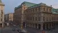 Rear view of the impressive historic building of the Vienna State Opera in Austria in the evening with stone facade.