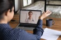 Rear view Indian woman making video call to doctor