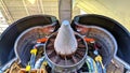 Rear view of a large aircraft engine during installation in the hangar. Common nozzle assembly Royalty Free Stock Photo
