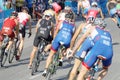 Rear view of large group of male cycling triathlon competitors